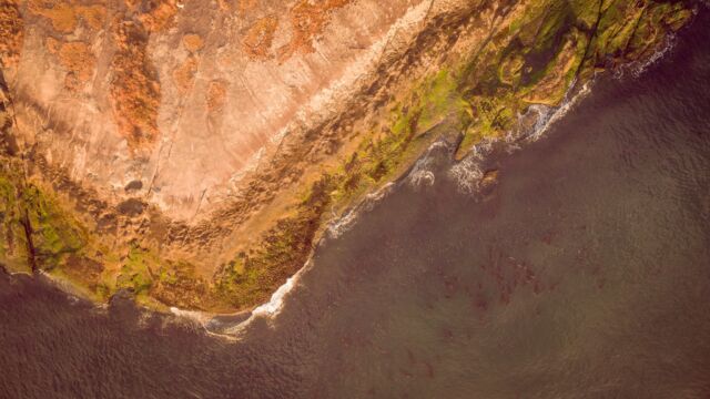Aerial view over the coastal bluffs of Bellhouse Park – photo credit Kris Krüg