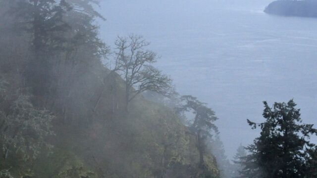 Fog rising on Mount Sutil's steep slopes