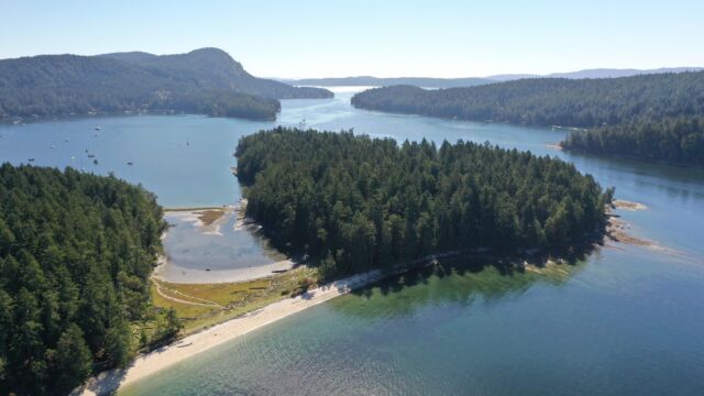 Sand spit crested with shell midden